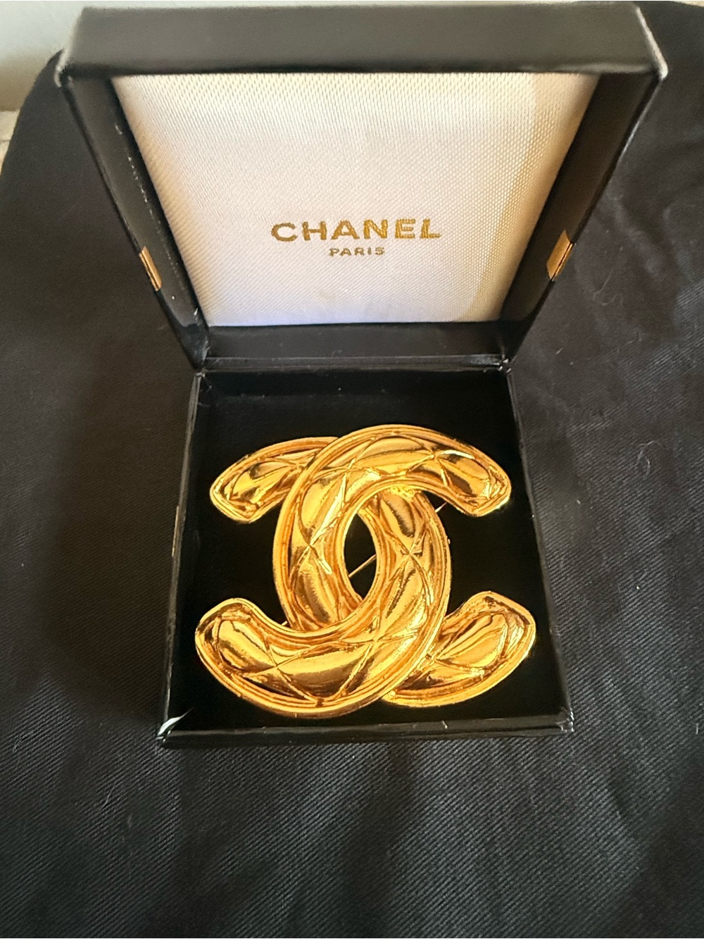 Chanel gold-plated quilted matelassé CC brooch.